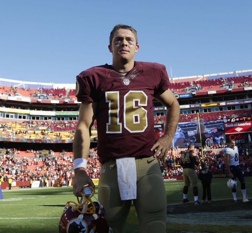 Washington Redskins quarterback Colt McCoy (16) stands on the field after an NFL football game against the Tennessee Titans, Sunday, Oct. 19, 2014, in Landover, Md. The Redskins won 19-17. (AP Photo/Pablo Martinez Monsivais)
