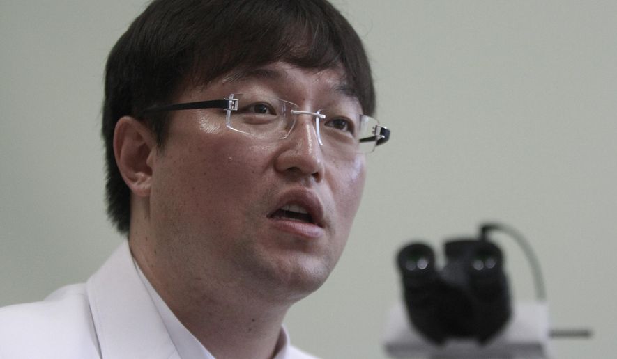 In this Sept. 5, 2014 photo, Ryu Young-joon speaks during an interview at Kangwon National University Hospital in Cuncheon, South Korea. Ryu, the whistle-blower who exposed breakthrough cloning research as a devastating fake says South Korea is still dominated by the values that allowed science fraudster Hwang Woo-suk to become an almost untouchable national hero. (AP Photo/Joyce Lee)