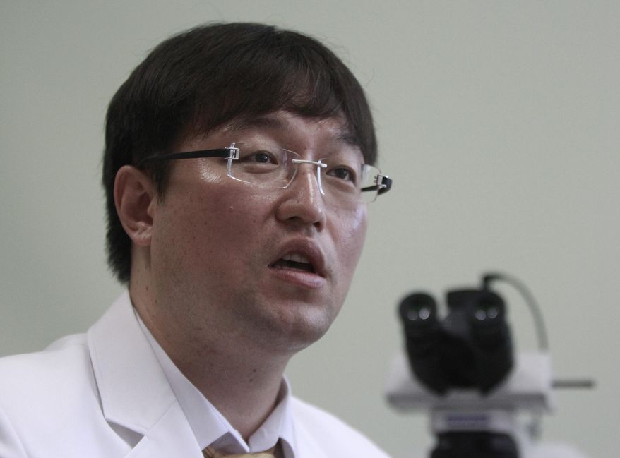 In this Sept. 5, 2014 photo, Ryu Young-joon speaks during an interview at Kangwon National University Hospital in Cuncheon, South Korea. Ryu, the whistle-blower who exposed breakthrough cloning research as a devastating fake says South Korea is still dominated by the values that allowed science fraudster Hwang Woo-suk to become an almost untouchable national hero. (AP Photo/Joyce Lee)