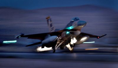 An F-16 Fighting Falcon aircraft takes off for a night mission at Nellis Air Force Base, Nev., Oct. 30, 2012. (U.S. Air Force photo by Val Gempis) ** FILE **