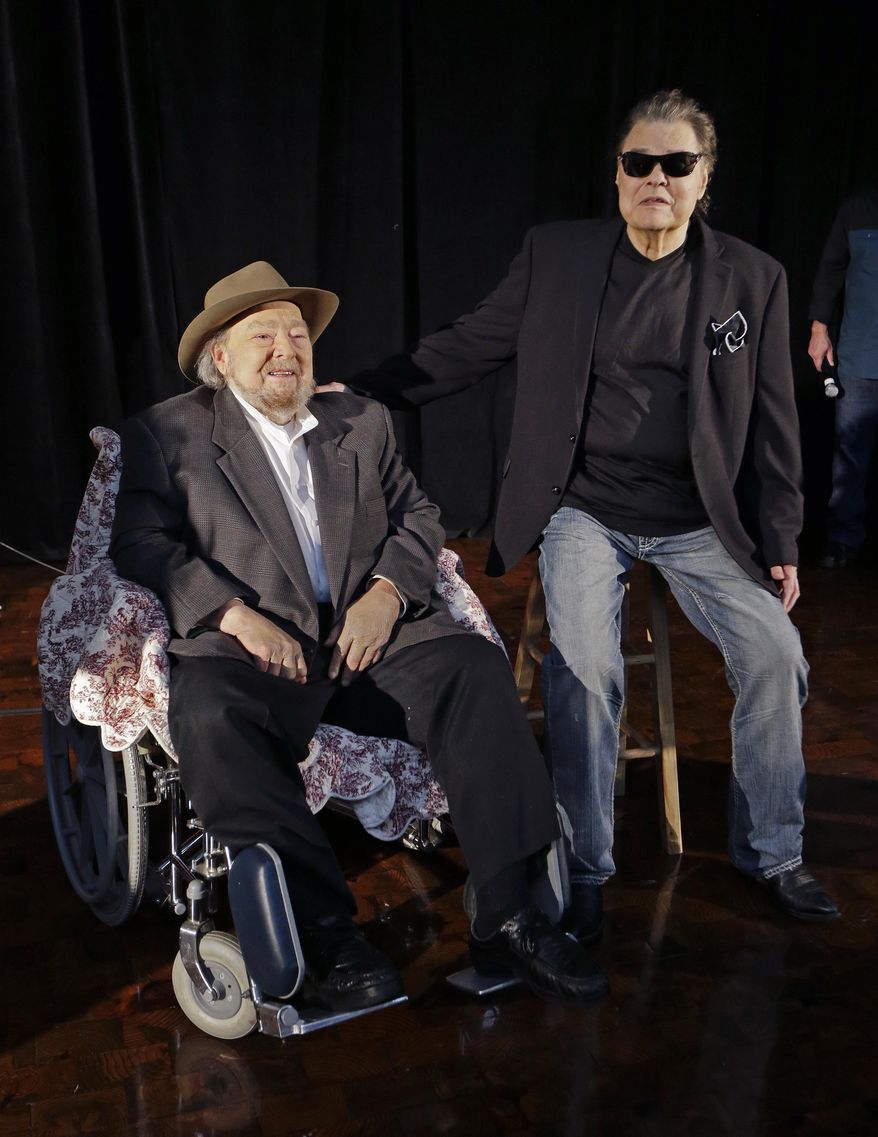 FILE - In this April 22, 2014 file photo, Mac Wiseman, left, and Ronnie Milsap pose after being introduced as two of three new inductees into the Country Music Hall of Fame in Nashville, Tenn. Wiseman and Milsap, along with the late Hank Cochran, will be inducted at a ceremony on Sunday, Oct. 26, in Nashville, Tenn. (AP Photo/Mark Humphrey, File)