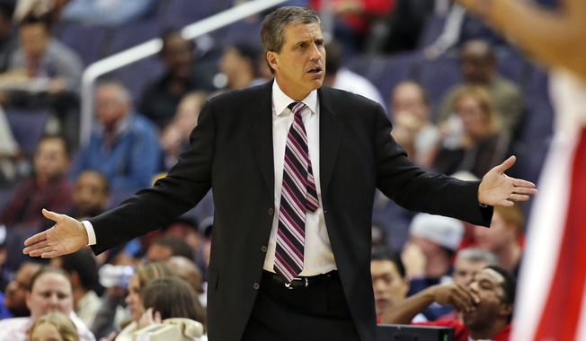 Washington Wizards head coach Randy Wittman questions an officials&#x27; call in the first half of a pre-season NBA basketball game against the Charlotte Hornets, Friday, Oct. 17, 2014 in Washington. (AP Photo/Alex Brandon)