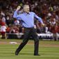 St. Louis Cardinals broadcaster Tim McCarver throws the ceremonial first pitch before Game 3 of baseball&#x27;s NL Division Series between the St. Louis Cardinals and the Los Angeles Dodgers, Monday, Oct. 6, 2014, in St. Louis. (AP Photo/Charles Rex Arbogast)