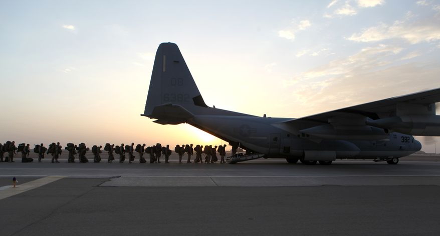 This handout photo provided Defense Department shows Marines and sailors with Marine Expeditionary Brigade &amp;#8211; Afghanistan load onto a KC-130 aircraft on the Camp Bastion, Afghanistan flightline, Monday, Oct. 27, 2014. The handover of the U.S. Marines&#x27; main base to Afghan control in the hardscrabble Helmand province is more than a signal that America&amp;#8217;s longest war is ending. It is a reminder of the enormous loss and sacrifice by Marines who swept in as part of President Barack Obama&amp;#8217;s surge of forces against a resurgent Taliban in 2009.  (AP Photo/Staff Sgt. John Jackson, Defense Department, US Marines) 