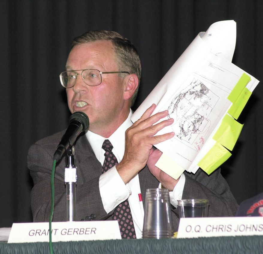 In this 2000 file photo, Grant Gerber holds a map of the Jarbidge, Nevada area during a panel in Elko, Nevada.  Gerber, a longtime lawyer and conservative political activist, died Saturday Oct. 25, 2014, from injuries he suffered when he fell off a horse in Kansas while protesting a federal crackdown on livestock grazing.  (AP/Photo, Elko Daily Free Press, Ross Andreson).