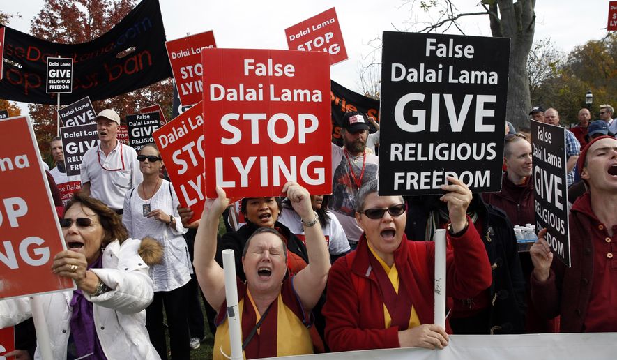 CORRECTS SPELLING OF DALAI LAMA - A group of protesters chant and shout outside Princeton University&#x27;s Jadwin Gymnasium where the Dalai Lama was speaking Tuesday, Oct. 28, 2014, in Princeton, N.J. The protesters claim The Dalai Lama discriminated against followers of a 400-year-old religious tradition of praying to the Buddhist Deity Dorje Shugden. (AP Photo/Mel Evans)