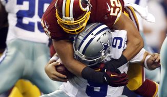 Dallas Cowboys quarterback Tony Romo (9) is sacked by Washington Redskins inside linebacker Keenan Robinson (52) during the second half of an NFL football game, Monday, Oct. 27, 2014, in Arlington, Texas. Romo suffered an injury during the play. (AP Photo/Tim Sharp)