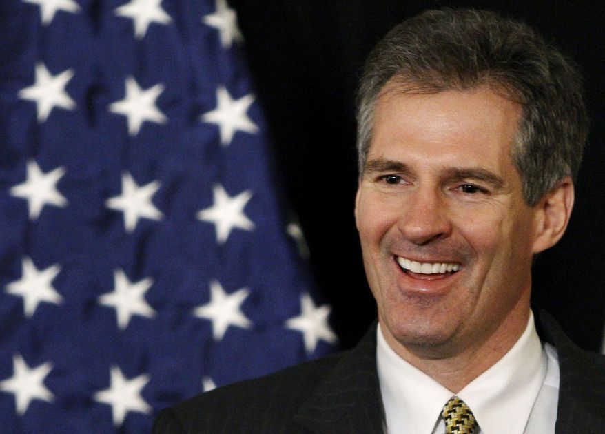 This Jan. 20, 2010, file photo shows then U.S. Sen.-elect Scott Brown, R-Mass., smiling as he addresses reporters during a news conference at the Park Plaza hotel in Boston. (AP Photo/Charles Krupa, File)