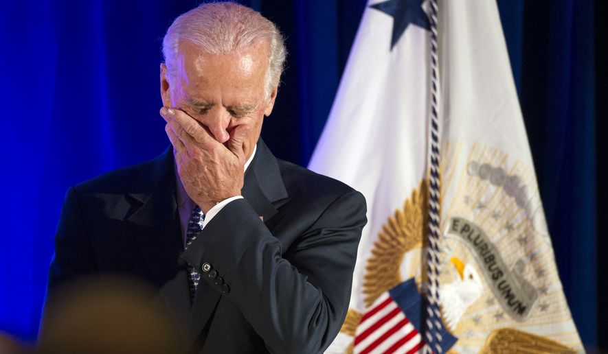 Vice President Joe Biden covers his mouth while laughing as he is introduced to address the 6th North American Strategic Infrastructure Leadership Forum welcoming reception in Washington, Tuesday, Oct. 28, 2014. The Forum is focused on infrastructure development in the US, Canada and Mexico. (AP Photo/Cliff Owen)