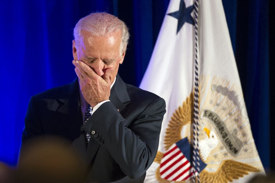 Vice President Joe Biden covers his mouth while laughing as he is introduced to address the 6th North American Strategic Infrastructure Leadership Forum welcoming reception in Washington, Tuesday, Oct. 28, 2014. The Forum is focused on infrastructure development in the US, Canada and Mexico. (AP Photo/Cliff Owen)