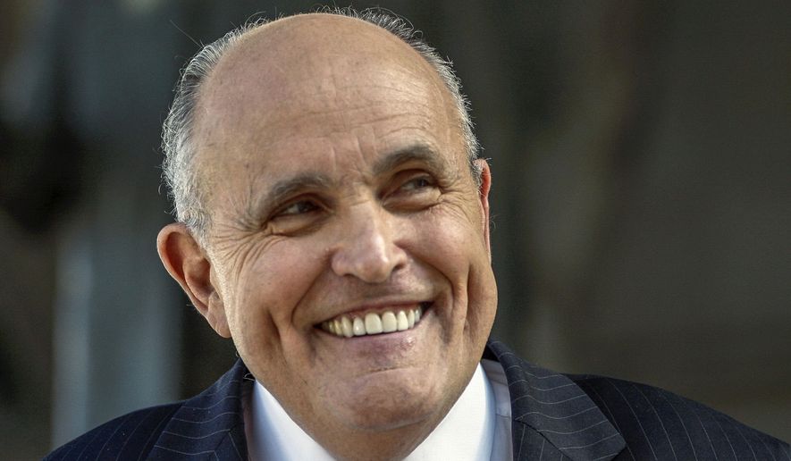 Lawyer and former New York City Mayor Rudy Giuliani speaks at a press conference in this Thursday, Oct. 16, 2014, file photo. (AP Photo/Damian Dovarganes, File)