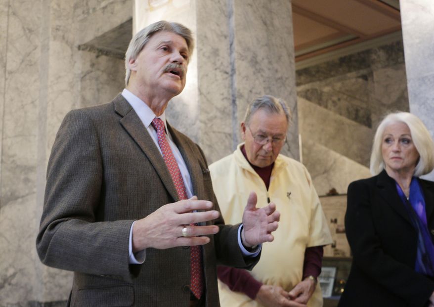 State Senator Tim Sheldon, a Democrat from Potlatch, talks to the media at a press conference on Tuesday, Oct. 28, 2014, in Olympia, Wash. Sheldon was joined by Republican supporters who are alleging campaign finance violations by a group that is sending out mailers in the race between him and another Democrat. (AP Photo/Rachel La Corte)