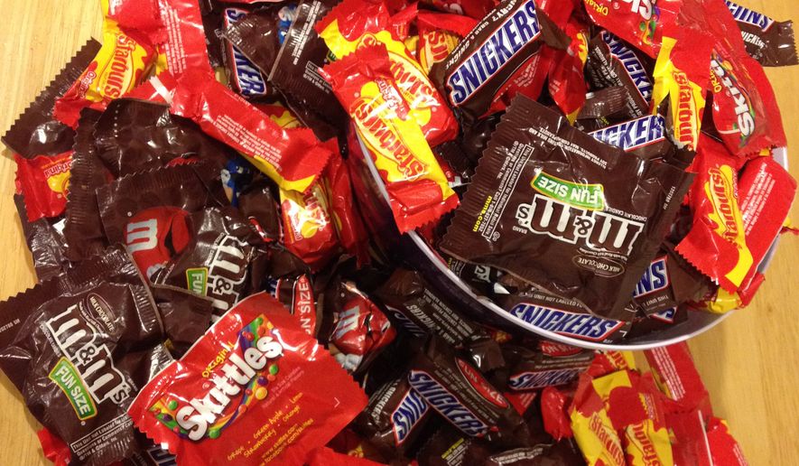 Candy purchased in anticipation of Halloween trick-or-treaters.  (AP Photo/Jason Varden)