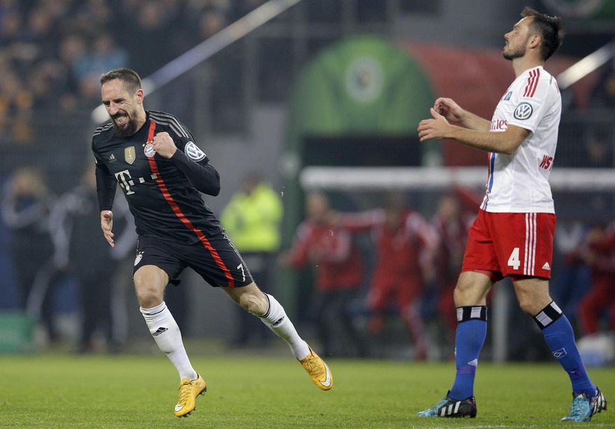 Bayern&#39;s Franck Ribery from France, left, celebrates after scoring his side&#39;s third goal during the German soccer cup second round match between Hamburger SV and FC Bayern Munich at the Imtech Arena Stadium in Hamburg, Germany, Wednesday, Oct. 29, 2014. At right is Hamburg&#39;s Heiko Westermann. (AP Photo/Michael Sohn)