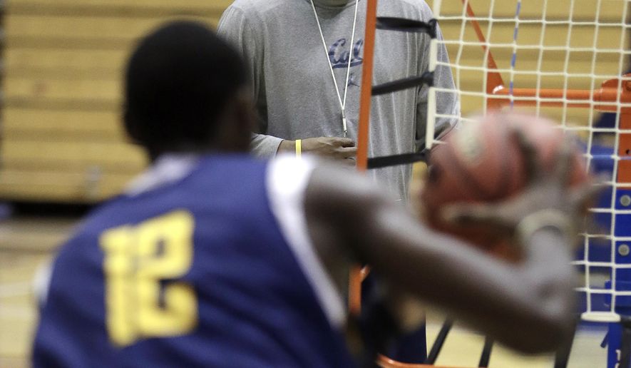 California mens basketball coach Cuonzo Martin watches during practice Tuesday, Oct. 28, 2014, in Berkeley, Calif. After leaving Tennessee last spring, Martin succeeds Mike Montgomery, who retired after last season.  (AP Photo/Ben Margot)