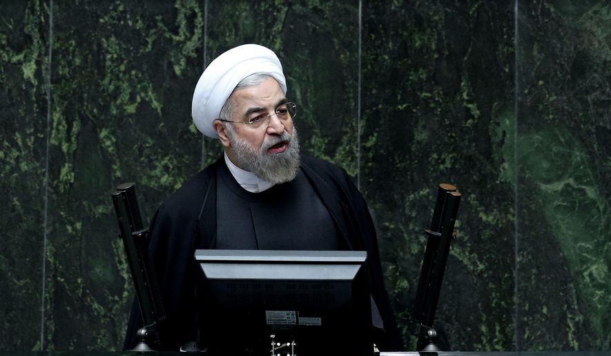 Iranian President Hassan Rouhani speaks during a debate on a vote of confidence for his choice for new minister of Science, Research and Technology Mahmoud Nili Ahmadabadi, in an open session of parliament in Tehran, Iran, Wednesday, Oct. 29, 2014. (AP Photo/Ebrahim Noroozi)