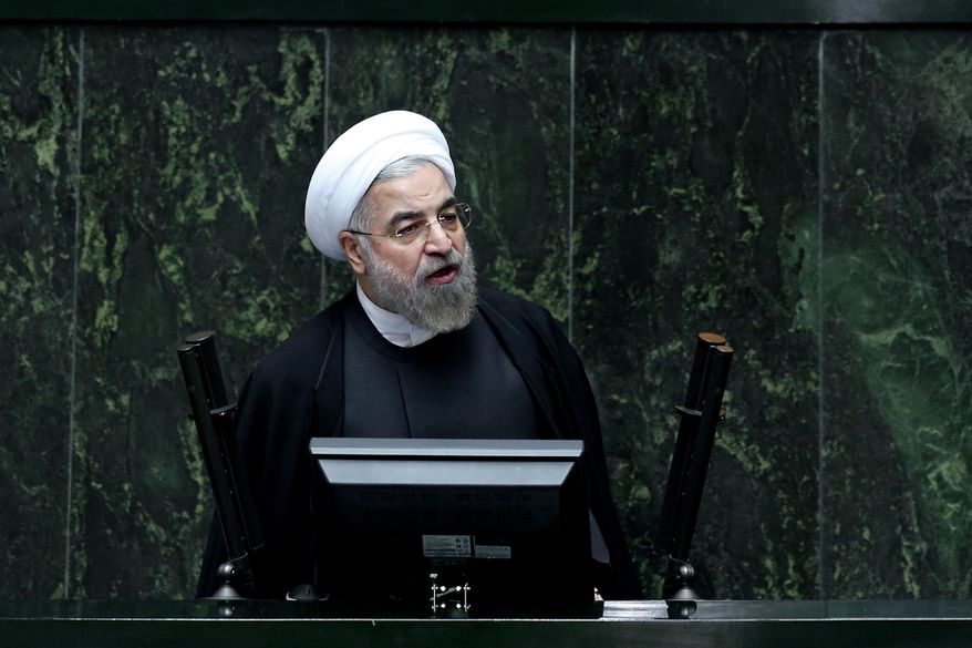 Iranian President Hassan Rouhani speaks during a debate on a vote of confidence for his choice for new minister of Science, Research and Technology Mahmoud Nili Ahmadabadi, in an open session of parliament in Tehran, Iran, Wednesday, Oct. 29, 2014. (AP Photo/Ebrahim Noroozi)