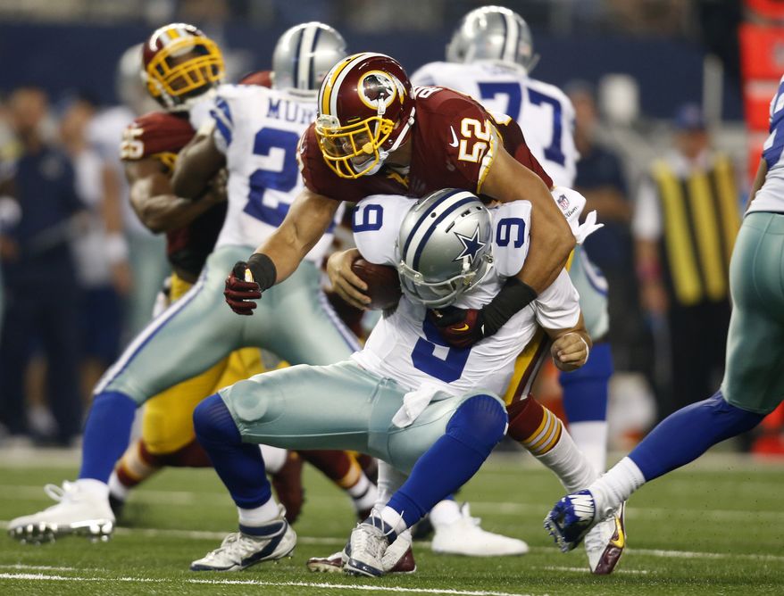 Dallas Cowboys quarterback Tony Romo (9) is sacked by Washington Redskins inside linebacker Keenan Robinson (52) during the second half of an NFL football game, Monday, Oct. 27, 2014, in Arlington, Texas. Romo suffered an unknown injury during the play. (AP Photo/Tim Sharp) 
