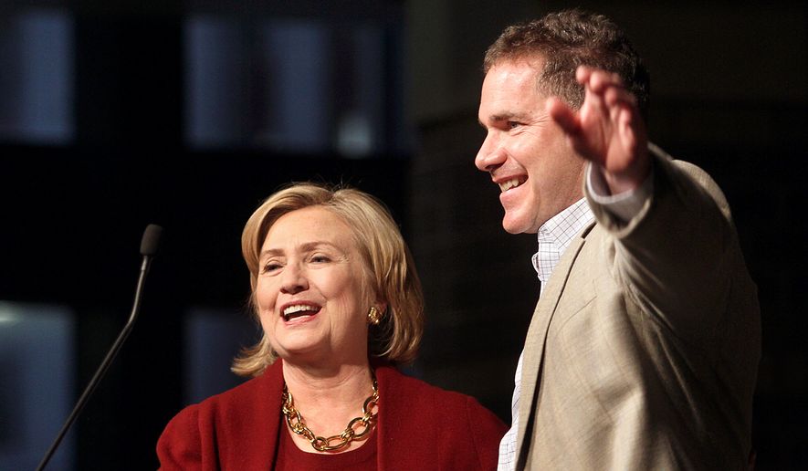 Former Secretary of State Hillary Rodham Clinton, left, campaigns with  Rep. Bruce Braley, D-Iowa,  who is running for the U.S. Senate during a stop at the RiverCenter in Davenport, Iowa, Wednesday October 29, 2014.  (AP Photo/The Quad City Times,Jeff Cook)