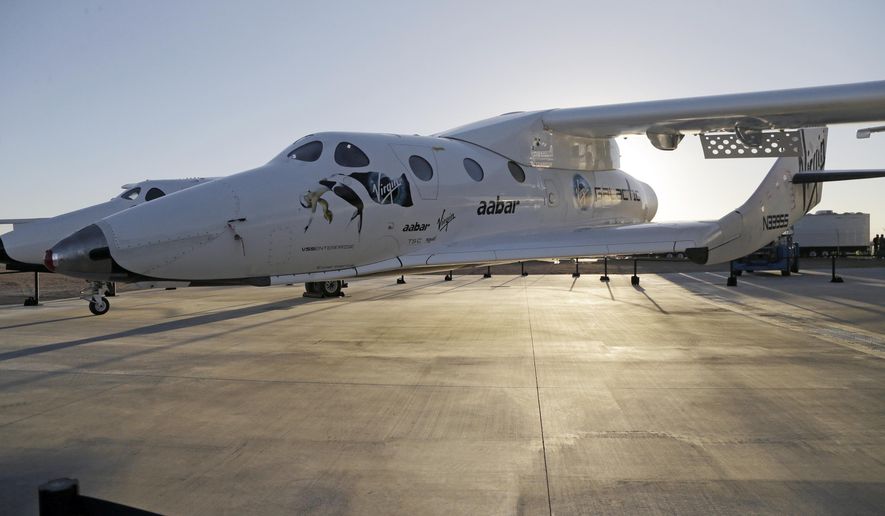 FILE - In this Sept. 25, 2013, file photo, shows Virgin Galactic's SpaceShipTwo at a Virgin Galactic hangar at Mojave Air and Space Port in Mojave, Calif. Virgin Galactic has reported an unspecified problem during a test flight of its SpaceShipTwo space tourism rocket. The company tweeted Friday, Oct. 31, 2014, morning that SpaceShipTwo was flying under rocket power and then tweeted that it had "experienced an in-flight anomaly." The tweet said more information would be forthcoming. (AP Photo/Reed Saxon, File)