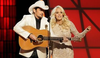 Brad Paisley and Carrie Underwood are again set to host the annual Country Music Association Awards. ABC will broadcast the 48th annual awards show Wednesday at 8 p.m. (Associated Press photographs)
