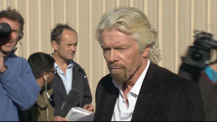 In this video grabbed image, billionaire Virgin Galactic founder Richard Branson, pauses before a news conference in which he saluted the bravery of test pilots, and vowed to find out what caused the crash of his prototype space tourism rocket that killed one crew member and injured another in Mojave, Calif., Saturday, Nov. 1, 2014. Virgin Galactic's SpaceShipTwo blew apart about 20 miles (32 kilometers) from the Mojave airfield after being released from a carrier aircraft Friday. (AP Photo/Scott Fain)