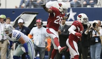 After making an interception against the Dallas Cowboys, Arizona Cardinals free safety Tyrann Mathieu (32) celebrates with free safety Rashad Johnson (26) during the second half of an NFL football game Sunday, Nov. 2, 2014, in Arlington, Texas. (AP Photo/Brandon Wade) 