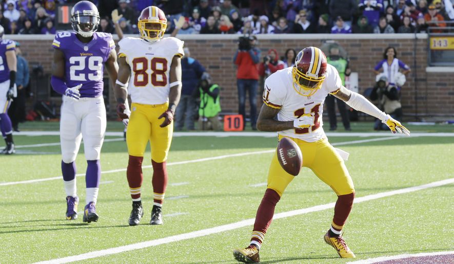 Washington Redskins wide receiver DeSean Jackson (11) celebrates after catching a 13-yard touchdown pass during the second half of an NFL football game against the Minnesota Vikings, Sunday, Nov. 2, 2014, in Minneapolis. (AP Photo/Ann Heisenfelt)