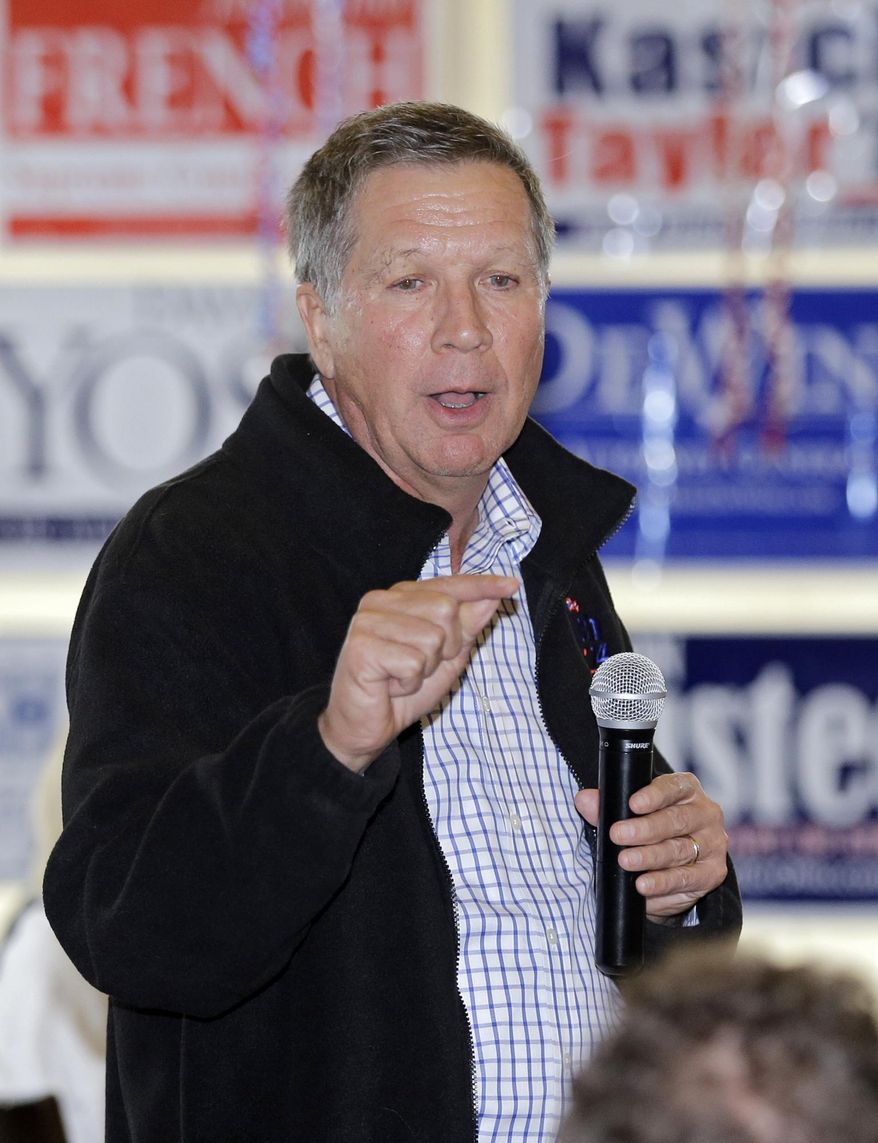 In this Oct. 30, 2014 photo, Ohio Gov. John Kasich speaks during a campaign rally at Joe's Deli in Rocky River, Ohio. A Columbus Dispatch poll indicates Kasich had a commanding lead over Democratic challenger Ed FitzGerald in the campaign’s waning days. (AP Photo/Mark Duncan)