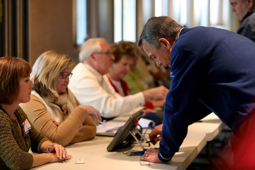 U.S. House Speaker John Boehner signs in before voting at VOA Park in West Chester, Ohio on Election Day, Tuesday, Nov. 4, 2014. (AP Photo/The Cincinnati Enquirer, Cara Owsley)  MANDATORY CREDIT;  NO SALES