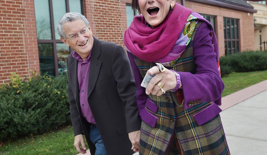 Rep. Rosa DeLauro, D-Conn., and her husband, political strategist Stan Greenberg, arrive to vote at Celentano Biotech, Health and Medical Magnet School on Canner Street in New Haven, Conn. on Tuesday, Nov. 4, 2014. (AP Photo/New Haven Register, Catherine Avalone)