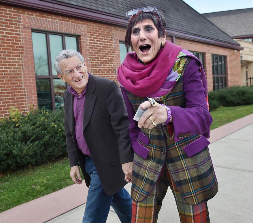 Rep. Rosa DeLauro, D-Conn., and her husband, political strategist Stan Greenberg, arrive to vote at Celentano Biotech, Health and Medical Magnet School on Canner Street in New Haven, Conn. on Tuesday, Nov. 4, 2014. (AP Photo/New Haven Register, Catherine Avalone)