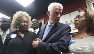 From left to right, M.A. Judge, Charlie Crist and Celeste Johnson talk during a campaign visit at Total Image Beauty Salon in Tampa, Tuesday, Nov. 4, 2014. (AP Photo/The Tampa Bay Times, Eve Edelheit)  TAMPA OUT; CITRUS COUNTY OUT; PORT CHARLOTTE OUT; BROOKSVILLE HERNANDO TODAY OUT