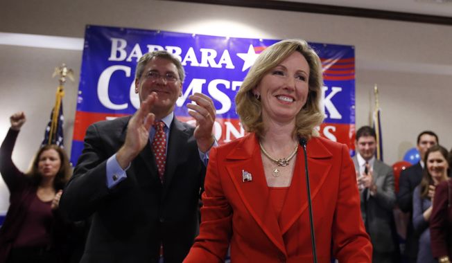Virginia Republican Congressional candidate Barbara Comstock, right, celebrates with her husband Chip Comstock, at her election night party, Tuesday, Nov. 4, 2014 in Ashburn, Va. Comstock ran against democrat John Foust for the 10th Congressional District of Virginia. (AP Photo/Alex Brandon)