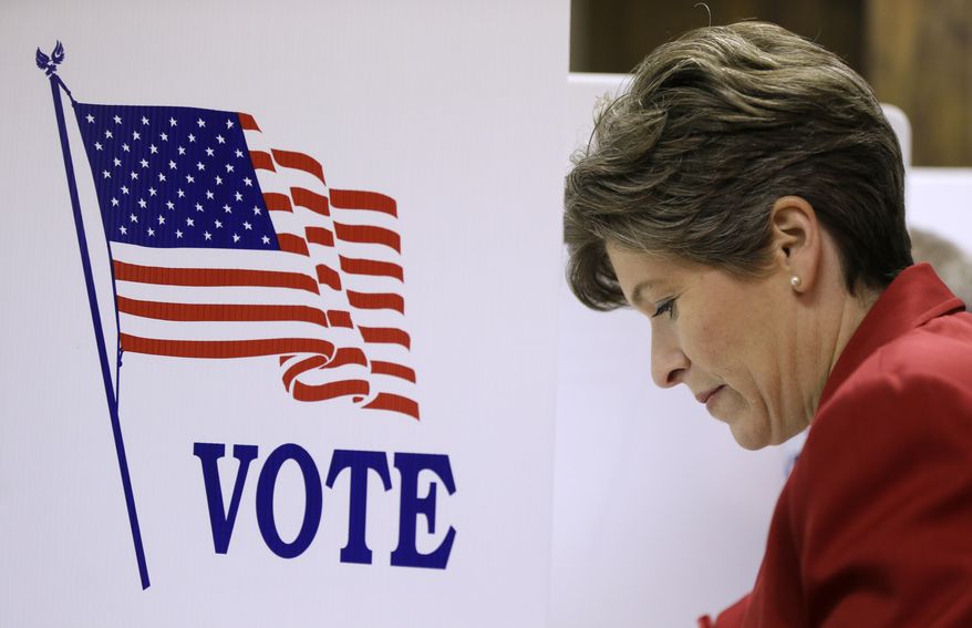 Republican Senate candidate State Sen. Joni Ernst casts her ballot in the general election, Tuesday, Nov. 4, 2014, in Red Oak, Iowa. Ernst is running against Democrat U.S. Rep. Bruce Braley for the U.S. Senate seat of Tom Harkin, who is not seeking reelection. (AP Photo/Charlie Neibergall)