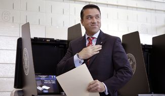 Congressman Michael Grimm smiles after voting in the borough of Staten Island in New York, Tuesday, Nov. 4, 2014. The republican incumbent, who is under indictment on criminal charges, is in a close race with his democratic challenger, Domenic Recchia. (AP Photo/Seth Wenig)