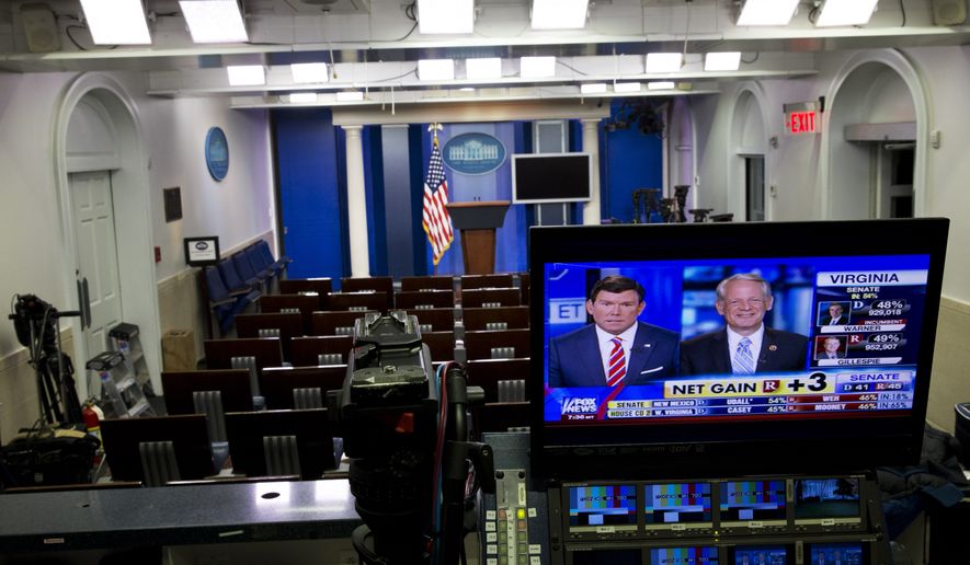 Fox News reports Republican gains in the Senate in an empty White House briefing room as poll numbers begin to pour in on election day, Tuesday, Nov. 4, 2014, in Washington. (AP Photo/Jacquelyn Martin)