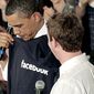 President Obama is given a Facebook sweatshirt by founder Mark Zuckerberg at an event in Silicon Valley, Calif., April 21, 2011. (Associated Press)