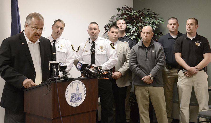 Monroe County Sheriff Dale Malone speaks at a news conference for an update on missing Maybee resident Chelsea Bruck, Tuesday, Nov. 4, 2014. The officials showed a similar party from June that she attended at the corner of Post and Williams Rds. Behind are deputies of the Monroe County Sheriff Dept. who are on the case. (AP Photo/The Monroe News,Tom Hawley)