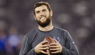 Indianapolis Colts quarterback Andrew Luck smiles as he warms up before an NFL football game against the New York Giants Monday, Nov. 3, 2014, in East Rutherford, N.J.  (AP Photo/Kathy Willens)