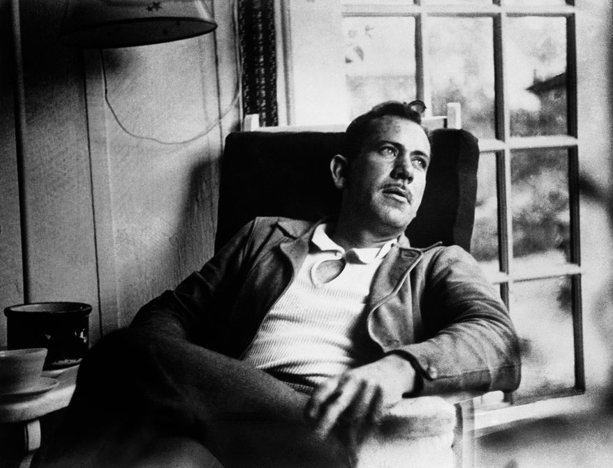 FILE - In an undated file photo, American author John Steinbeck, takes a rest from work on a new novel. A rare Steinbeck WWII story titled "With Your Wings," an inspirational story about a black pilot that Steinbeck wrote for Orson Welles' radio program, and then seemed to disappear, is getting a second release. Andrew F. Gulli, managing editor of the Birmingham, Michigan-based quarterly The Strand Magazine, features it in The Strand's holiday issue, which comes out Friday, Nov. 7, 2014. (AP Photo. File)