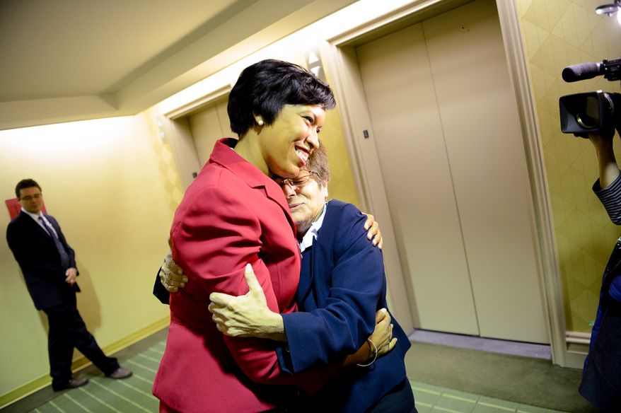 Washington, D.C. Mayor elect Muriel Bowser gets a hug from supporter Judi Gold following a press conference held at the National Press Club a day after the election, Washington, D.C., Wednesday, November 5, 2014. (Andrew Harnik/The Washington Times)