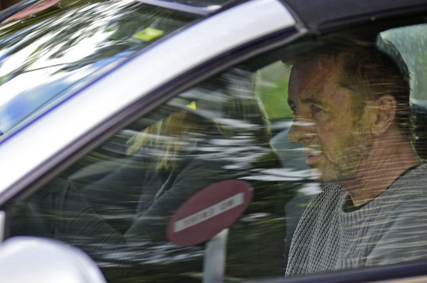 Phil Rudd, the drummer for rock band AC/DC, leaves a court house in Tauranga, New Zealand, Thursday, Nov. 6, 2014, after being charged with attempting to procure murder. The 60-year-old has also been charged with threatening to kill and possession of methamphetamine and marijuana. (AP Photo/Bay Of Plenty Times via The New Zealand Herald, George Novak) NEW ZEALAND OUT, AUSTRALIA OUT