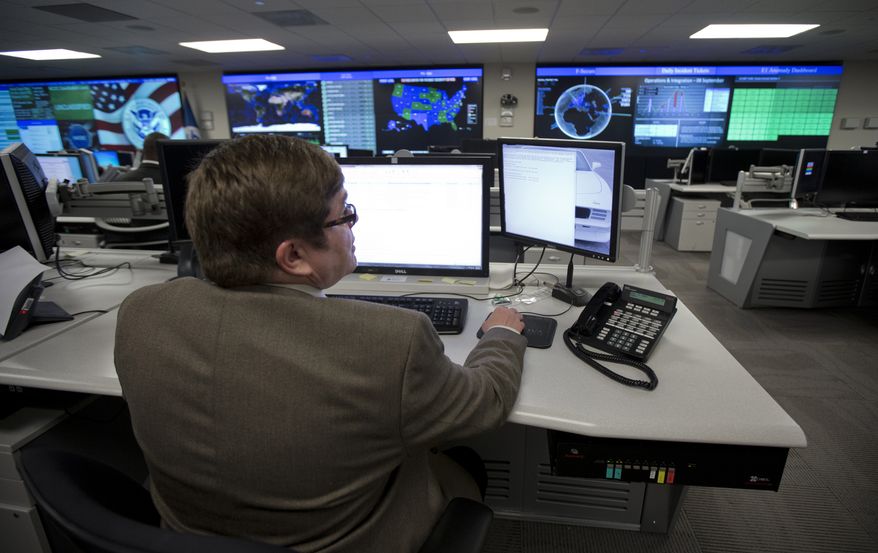In this Tuesday, Sept. 9, 2014, file photo photo, specialists work at the National Cybersecurity and Communications Integration Center (NCCIC) in Arlington, Va. (AP Photo/Manuel Balce Ceneta) ** FILE **