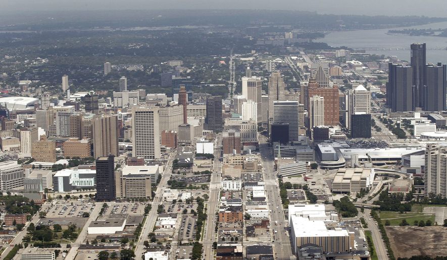 FILE - This July 17, 2013 aerial photo shows the city of Detroit. On Friday, Nov. 7, 2014, federal bankruptcy judge Steven Rhodes is expected to decide whether Detroit&#39;s plan to exit bankruptcy is fair and feasible. (AP Photo/Paul Sancya, File)