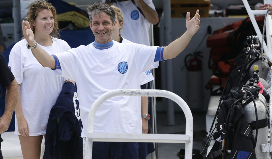 In this July 2, 2014 file photo, Fabien Cousteau reacts as he returns to the dock after 31 days undersea in the Aquarius Reef Base, in Islamorada, in the Florida Keys. Cousteau and his team of filmmakers and scientists dove June 1 to study the effects of climate change and pollution on a nearby coral reef. Cousteau documented the 31-day underwater living experiment in a film, which was shown at the Blue Ocean Film Festival, held Nov. 3-9, 2014 in St. Petersburg, Fla. The festival is one of the biggest environmental documentary events in the world - and also the rise of the emerging genre of cli-fi movies, short for "climate fiction." (AP Photo/Lynne Sladky, File)FILE