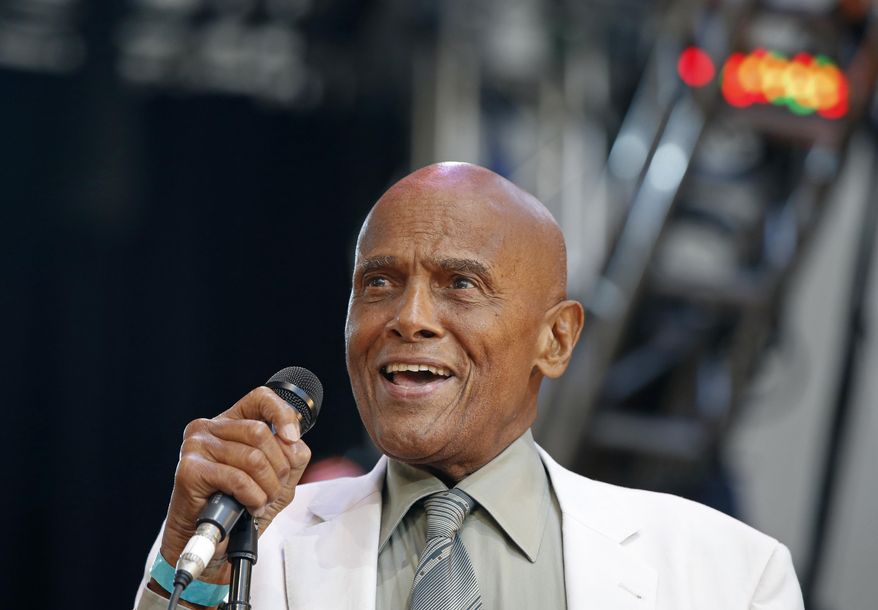 FILE - In this July 20, 2014 file photo, singer and activist Harry Belafonte speaks during a memorial tribute concert for folk icon and civil rights activist Pete Seeger at Lincoln Center's Damrosch Park in New York. The Academy of Motion Picture Arts and Sciences will present Honorary Awards to Jean-Claude Carrière, Hayao Miyazaki and Maureen O’Hara, and the Jean Hersholt Humanitarian Award to Belafonte. All four awards will be presented at the Academy’s 6th Annual Governors Awards on Saturday, November 8, 2014, at the Ray Dolby Ballroom at Hollywood & Highland Center in Los Angeles. (AP Photo/Kathy Willens, File)