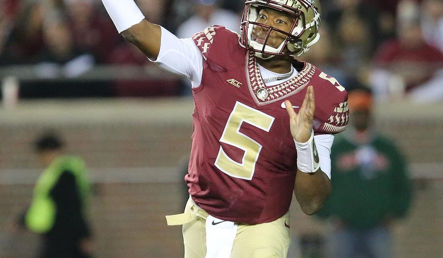 Florida State&#39;s Jameis Winston throws for a completion against Virginia in the third quarter of an NCAA college football game, Saturday, Nov. 8, 2014, in Tallahassee, Fla. Florida State won the game 34-20. (AP Photo/Steve Cannon)