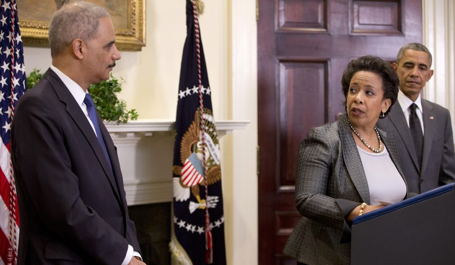 US Attorney Loretta Lynch, center, looks to Attorney General Eric Holder as with President Barack Obama at right, in the Roosevelt Room of the White House in Washington, Saturday, Nov. 8, 2014, where the president announced that he will nominate Lynch to replace Holder as Attorney General. (AP Photo/Carolyn Kaster)