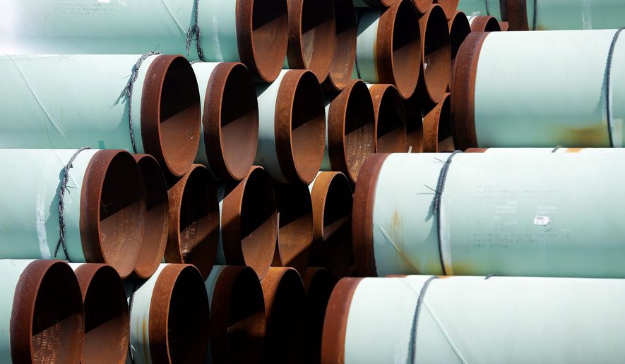 Some of more than 350 miles of pipe awaiting shipment for the Keystone XL oil pipeline is stored at Welspun Tubular, in Little Rock, Ark., Wednesday, Aug. 20, 2014. (AP Photo/Danny Johnston) ** FILE **
